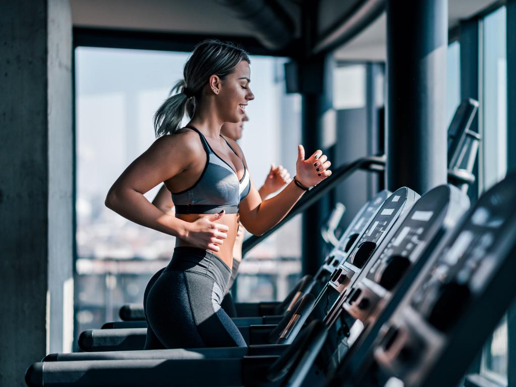 A young Australian woman running on a treadmill